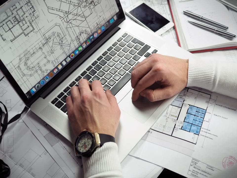 A desk with office work materials, representing planning and informed decisions
