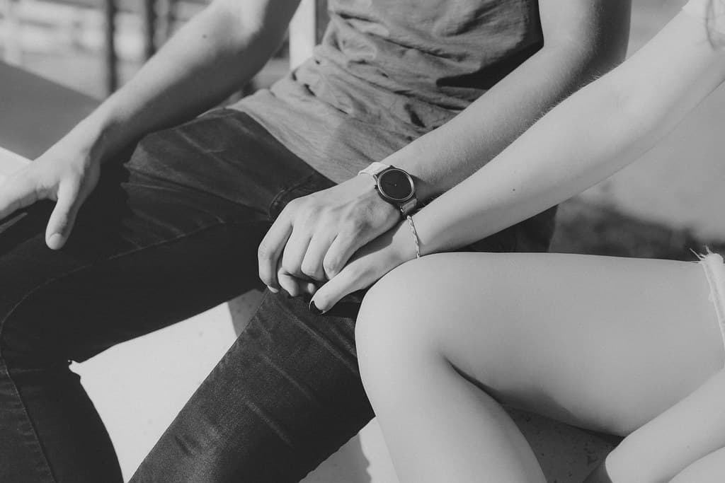 Two people holding hands, representing connection and meaningful relationships