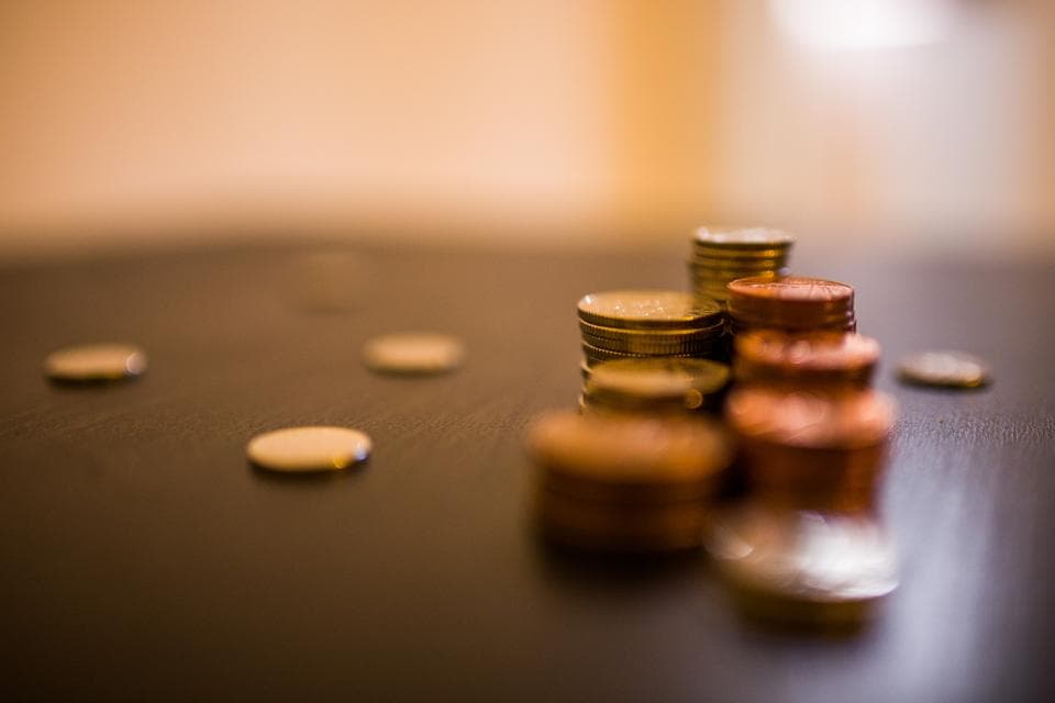 Stacks of coins representing cash flow, saving, and financial choices